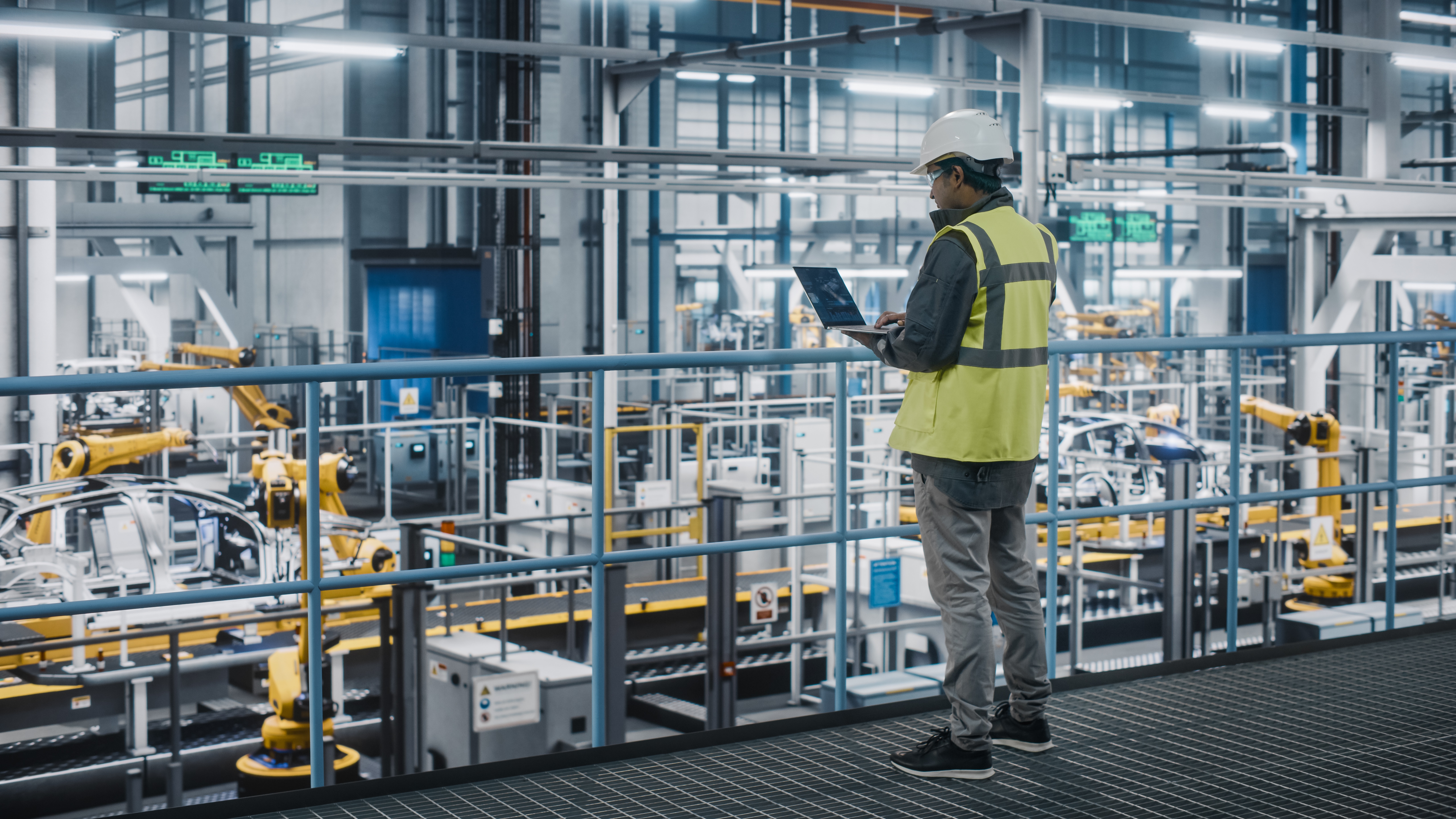 Man overviewing production facility